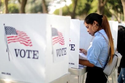 Desteny Martinez, 18, votes for the first time, in the U.S. congressional and gubernatorial midterm elections in Norwalk